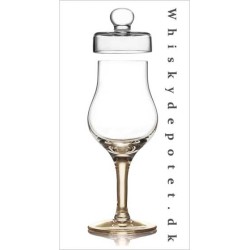 Amber Whisky glas med låg og ravfarvet fod.